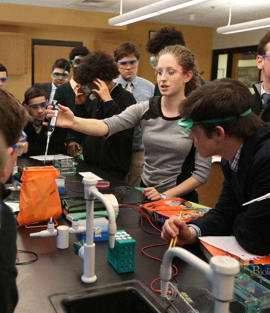 Teacher gives lesson in science class